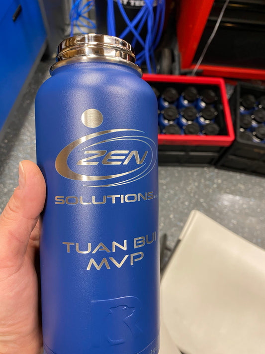 Blue RTIC bottle with ZEN Solutions engraving—example on customer-supplied drinkware; vessel not included.