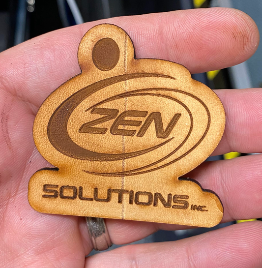 Custom laser engraving service example: ZEN Solutions design laser engraved on genuine leather.