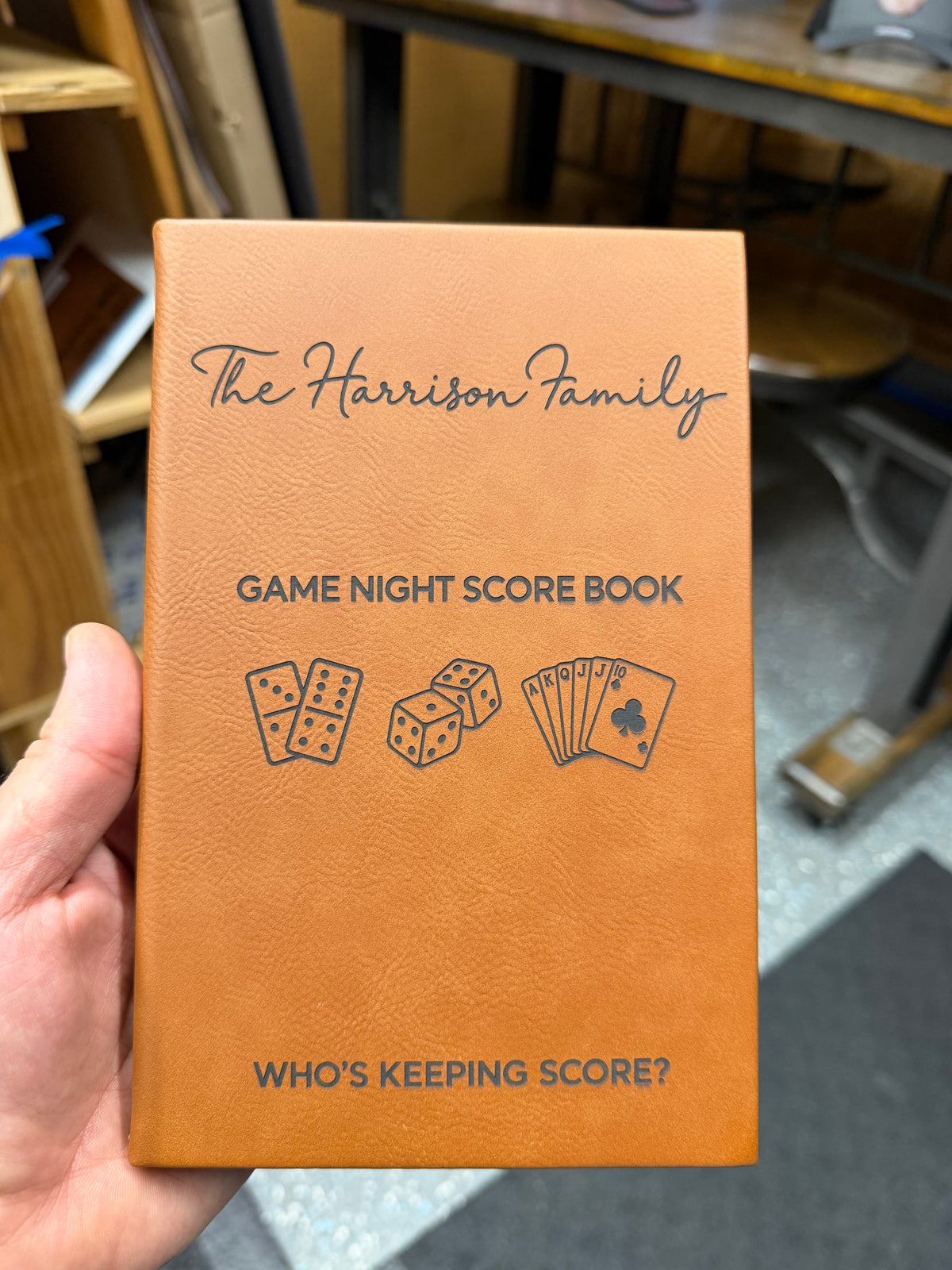 Personalized laser-engraved leatherette journal in the Raw Hide color, with a family game-night scorebook design