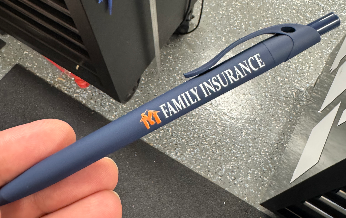 Navy blue pen with Family Insurance printed branding.